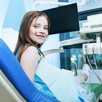 Bellevue Kids Dentist - Young girl sitting in dentist chair