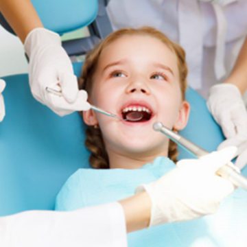 Bellevue Kids Dentist - Young girl having her teeth examined